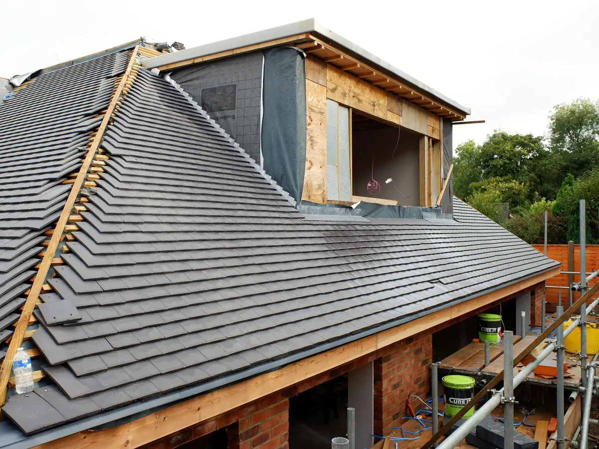 New roof being tiled around a dormer extension